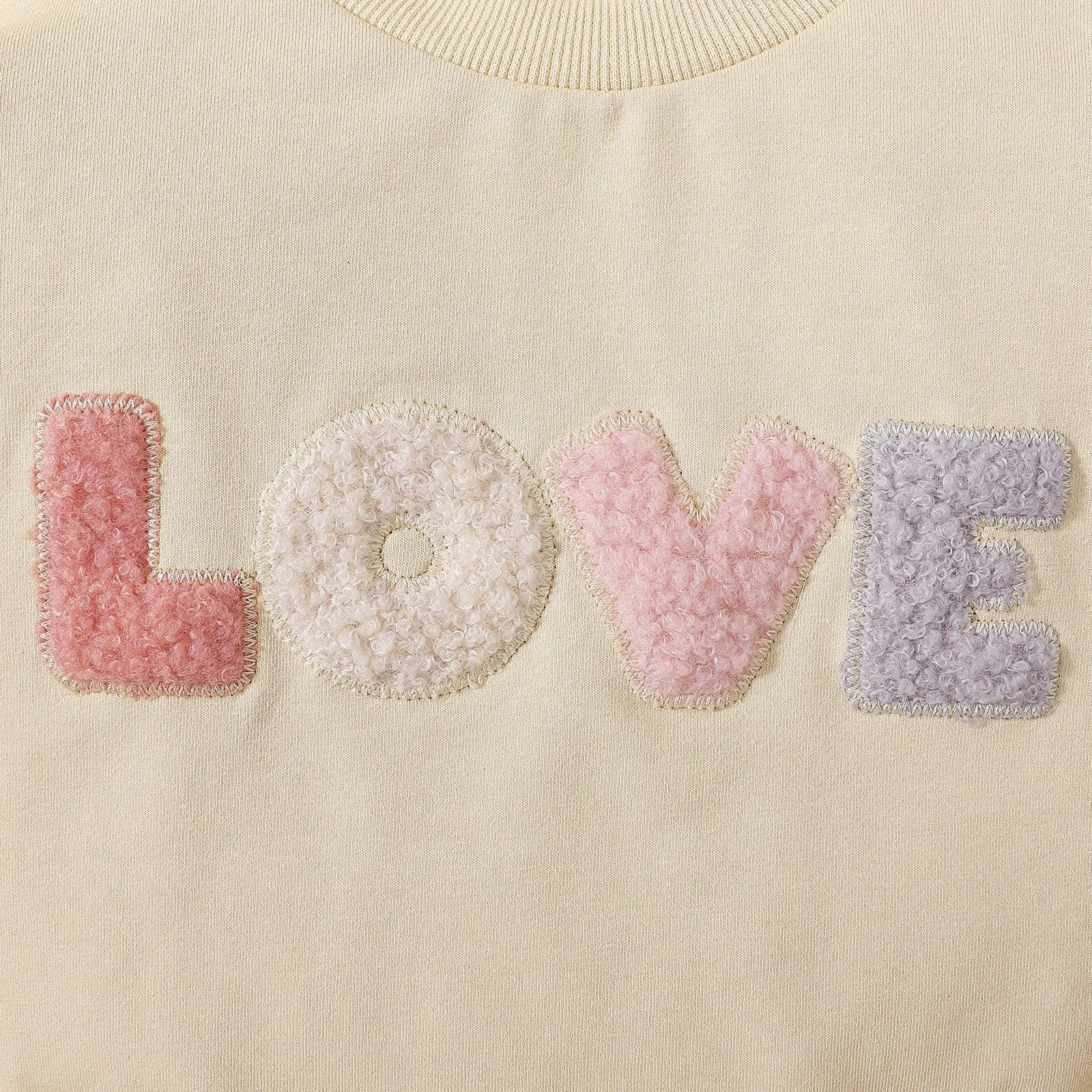 Love embroidered long-sleeved romper