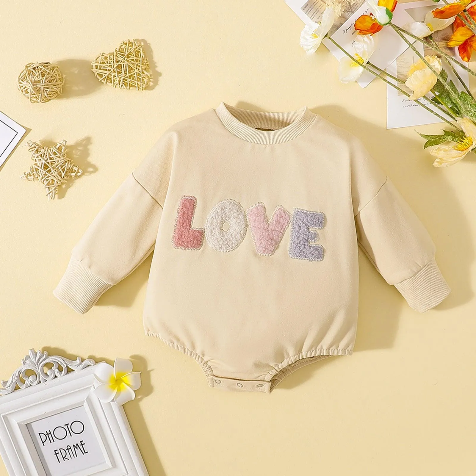 Love embroidered long-sleeved romper